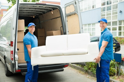 Removal team planning a Northwood house move on a residential street