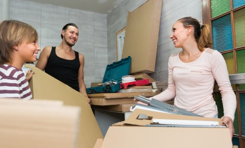 House removalists loading furniture in Northwood street setting