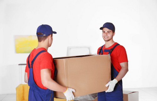 Packed boxes and furniture prepared for a Northwood home removal