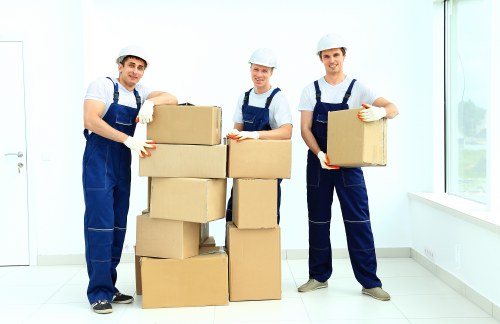 Office furniture and boxes being moved with a removals van