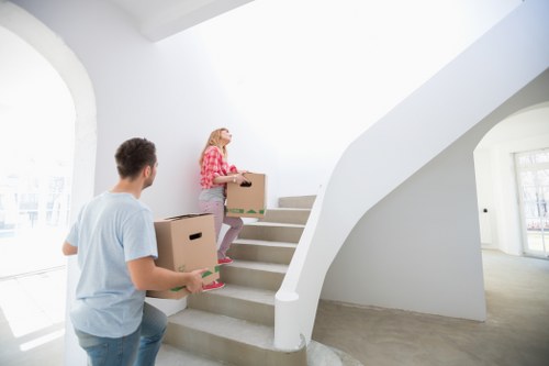 Professional team handling desks and office furniture during a Northwood business move