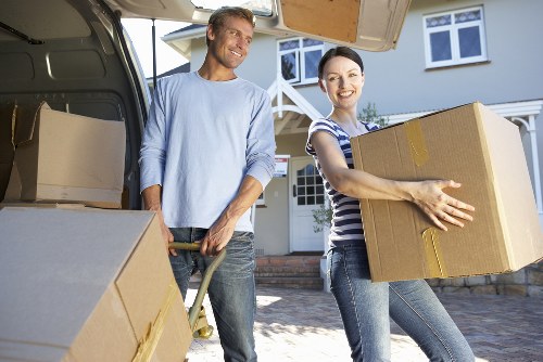 Loading items into a van on a Northwood residential street